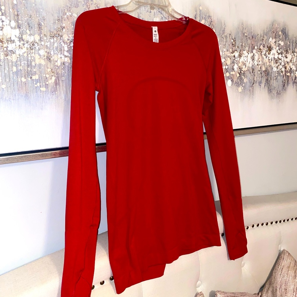 Red Lululemon long sleeve swiftly tech. Size 6. Great condition, gently worn!